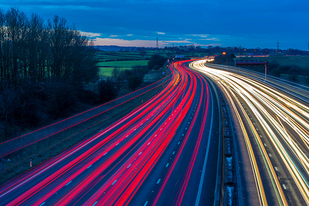 View of traffic trail lights on M1 motorway near Chesterfield, Derbyshire, England, United Kingdom, Europe