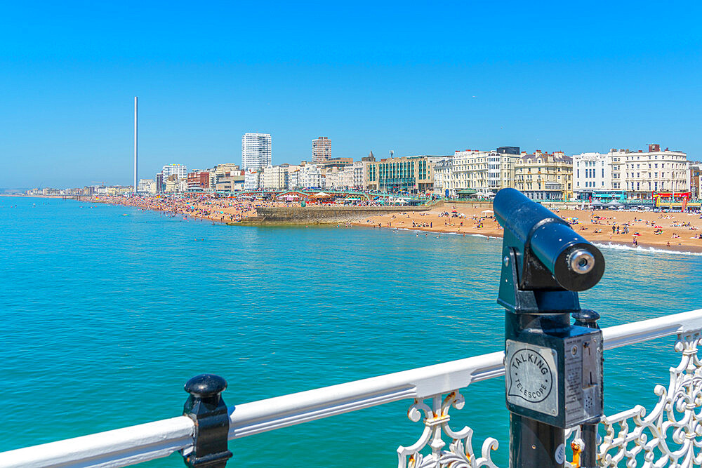 View of beach and telescope on a sunny day from Brighton Palace Pier, Brighton, East Sussex, England, United Kingdom, Europe