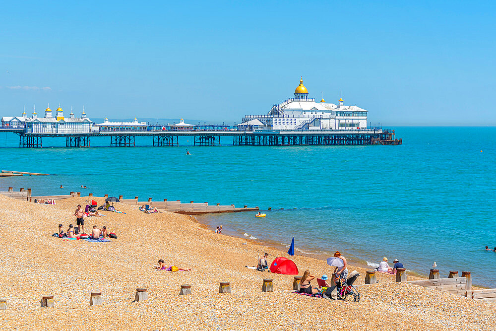 View of Eastbourne Pier and beach in summer time, Eastbourne, East Sussex, England, United Kingdom, Europe