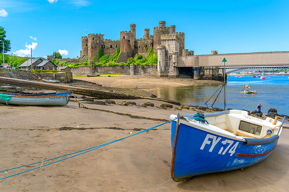 View of Conwy Castle, UNESCO World Heritage Site, and boats on the shore, Conwy, Conway County Borough, Wales, United Kingdom, Europe