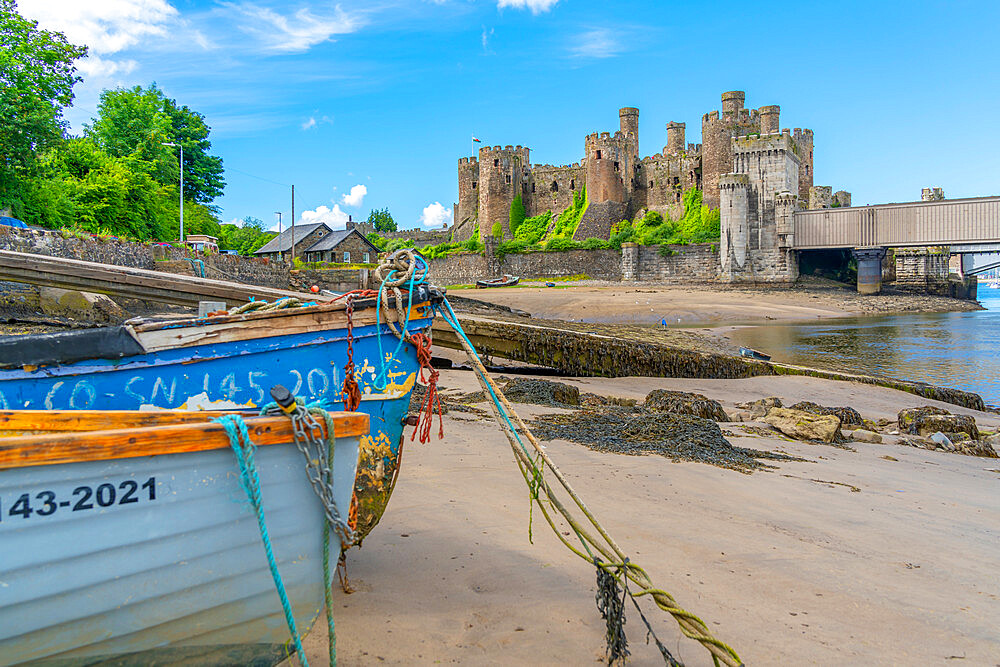 View of Conwy Castle, UNESCO World Heritage Site, and boats on the shore, Conwy, Conway County Borough, Wales, United Kingdom, Europe