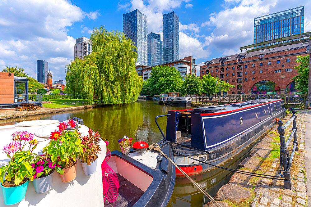 View of canal boat and contemporary skyline from Castlefield, Castlefield Canal, Manchester, England, United Kingdom, Europe