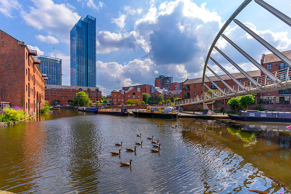 View of canal boats and contemporary skyline from Castlefield, Castlefield Canal, Manchester, England, United Kingdom, Europe