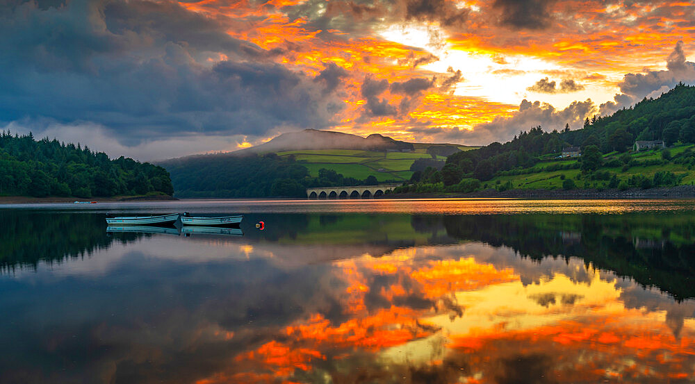 View of dramatic clouds reflecting in Ladybower Reservoir at sunset, Peak District National Park, Derbyshire, England, United Kingdom, Europe