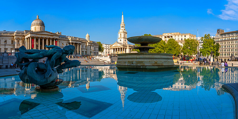 View of The National Gallery, St. Martins-in-the-Fields church and fountains in Trafalgar Square, Westminster, London, England, United Kingdom, Europe