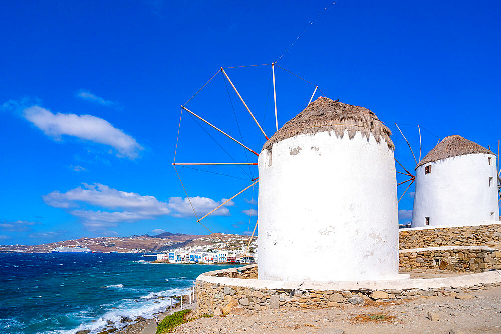 View of windmills and town in background, Mykonos Town, Mykonos, Cyclades Islands, Greek Islands, Aegean Sea, Greece, Europe