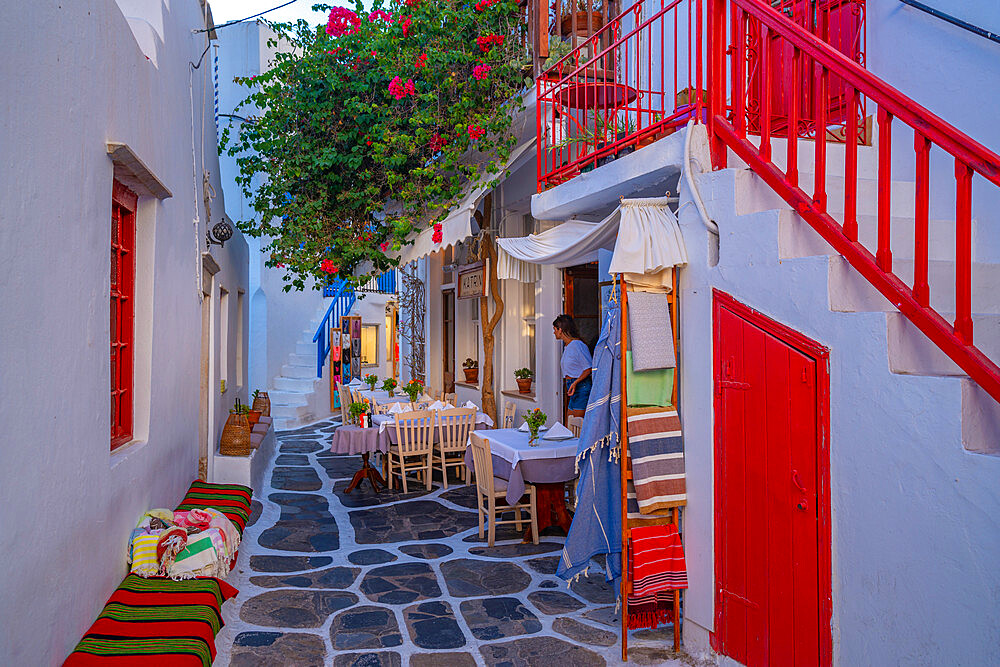 View of cafe in colourful narrow cobbled street, Mykonos Town, Mykonos, Cyclades Islands, Greek Islands, Aegean Sea, Greece, Europe