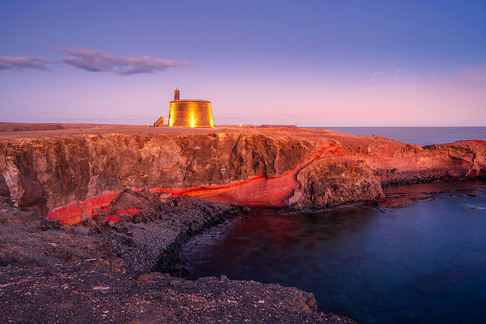 View of Castillo del Aguila o de las Coloradas at dusk, Playa Blanca, Lanzarote, Canary Islands, Spain, Atlantic, Europe