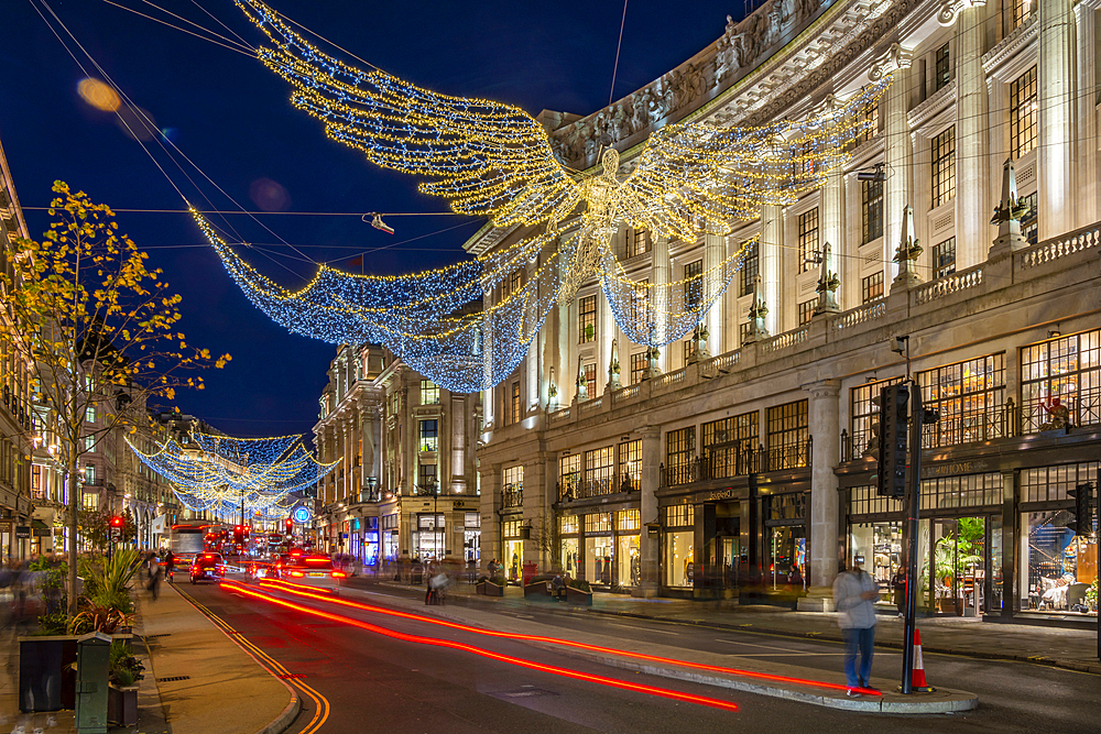 View of Christmas lights and shops on Regent Street at Christmas, London, England, United Kingdom, Europe