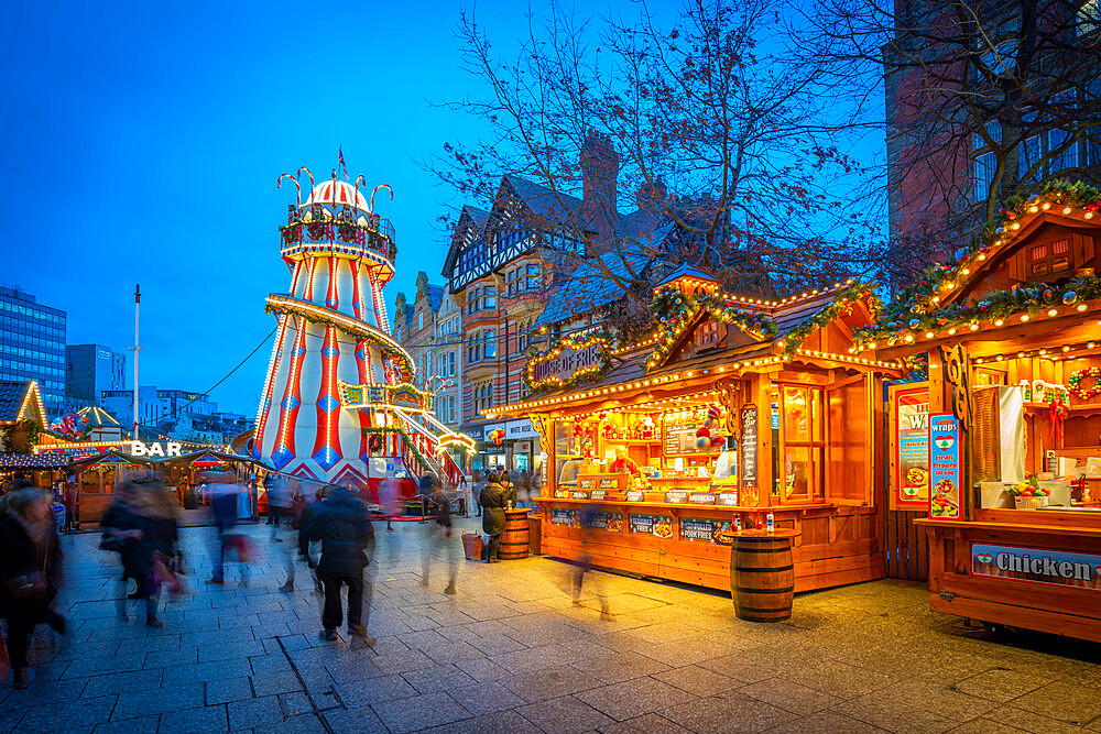 View of Christmas market stalls and helter skelter on Old Market Square, Nottingham, Nottinghamshire, England, United Kingdom, Europe