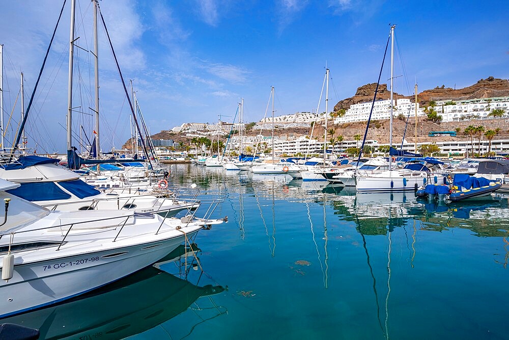 View of harbour, boats and town, Playa de Puerto Rico, Gran Canaria, Canary Islands, Spain, Atlantic, Europe