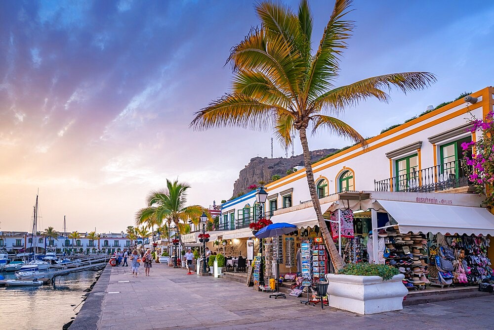 View of cafes and restaurants and palm trees in the Old Port, Puerto de Mogan at sunset, Gran Canaria, Canary Islands, Spain, Atlantic, Europe