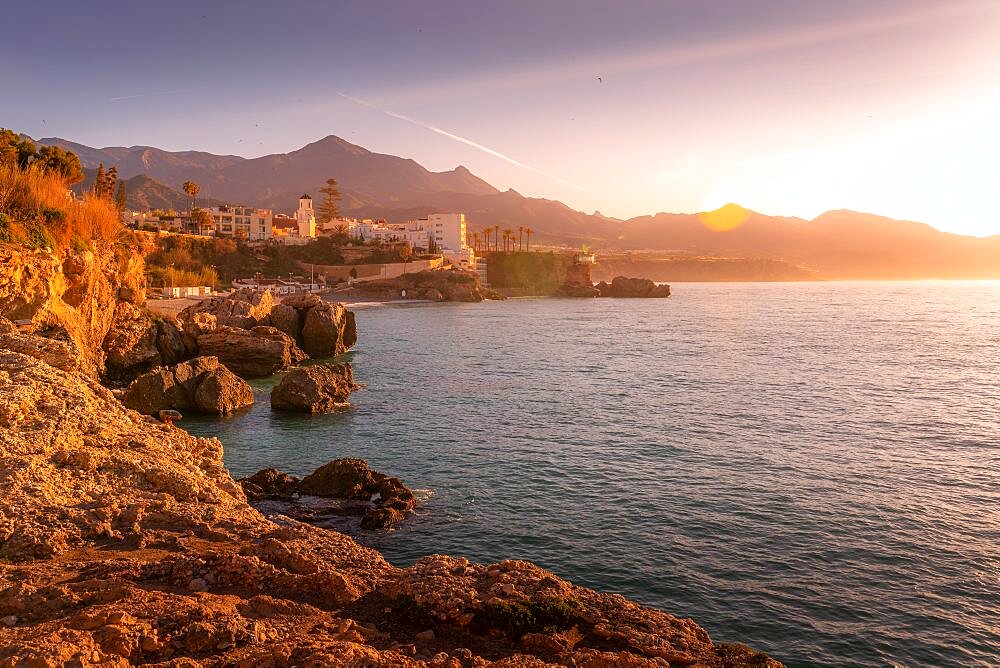 View of coastline and Iglesia de El Salvador Church at sunrise in Nerja, Costa del Sol, Malaga Province, Andalusia, Spain, Europe