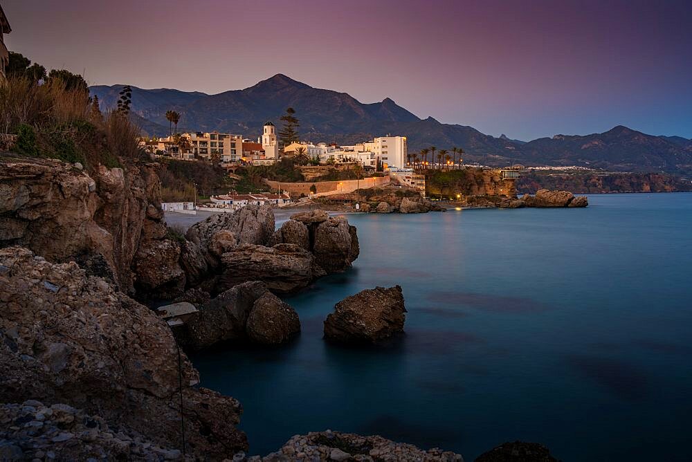 View of Parroquia El Salvador and coast at dusk in Nerja, Nerja, Malaga Province, Andalucia, Spain, Europe