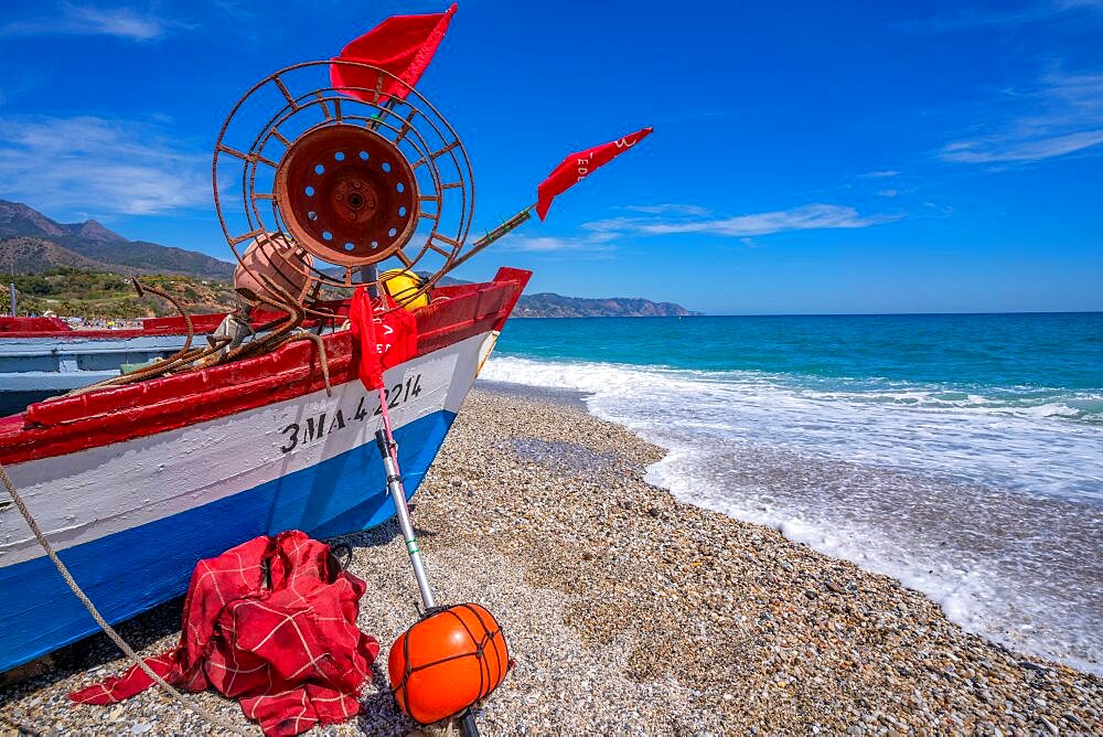 View of boat on Playa de Burriana beach in Nerja, Costa del Sol, Malaga Province, Andalusia, Spain, Europe