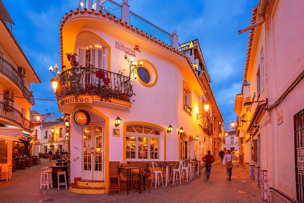 View of cafe and restaurant in the old town of Nerja at dusk, Nerja, Costa del Sol, Malaga Province, Andalusia, Spain, Europe