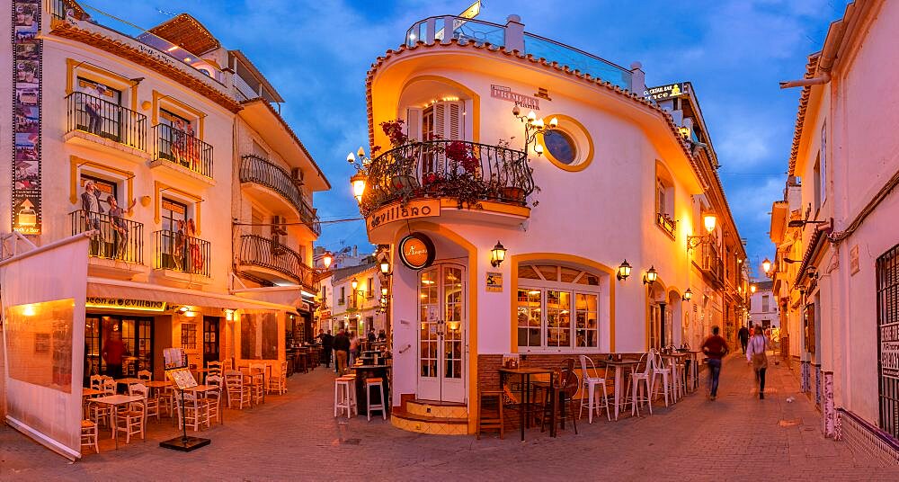 View of cafe and restaurant in the old town of Nerja at dusk, Nerja, Costa del Sol, Malaga Province, Andalusia, Spain, Europe