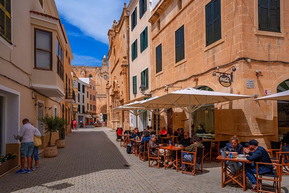 View of cafe in street iand cathedral in background, Ciutadella, Memorca, Balearic Islands, Spain, Europe