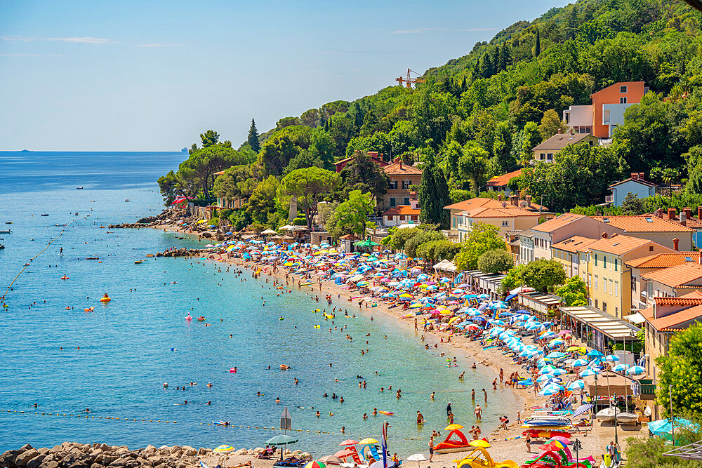 View of rooftops and beach in Moscenicka Draga, Kvarner Bay, Eastern Istria, Croatia, Europe