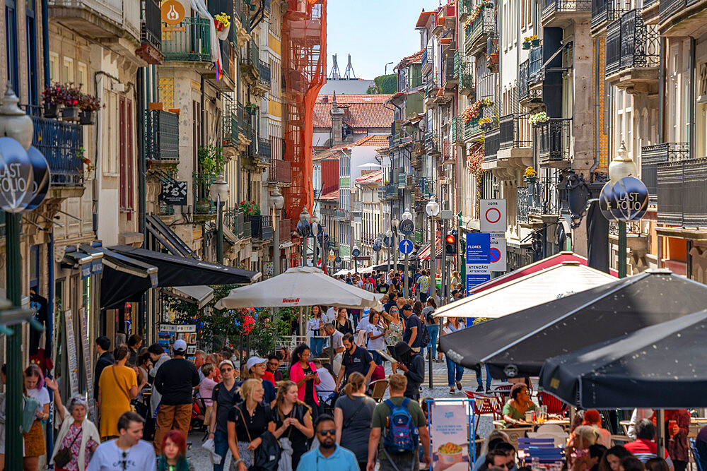 View of cafes, shops and bars on busy Rua das Flores, Porto, Norte, Portugal, Europe