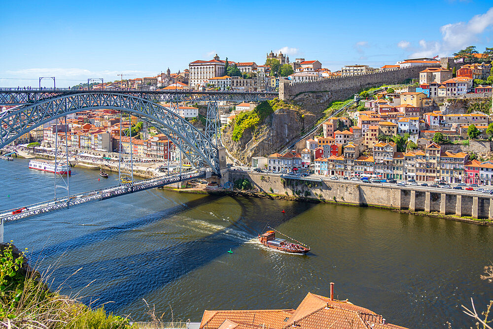 View of the Dom Luis I bridge over Douro River and terracota rooftops, UNESCO World Heritage Site, Porto, Norte, Portugal, Europe