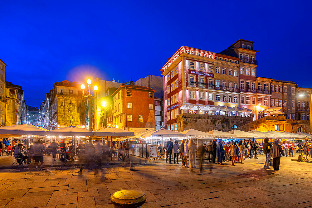 View of bars and restaurants at waterfront of Douro River at dusk, Porto, Norte, Portugal, Europe