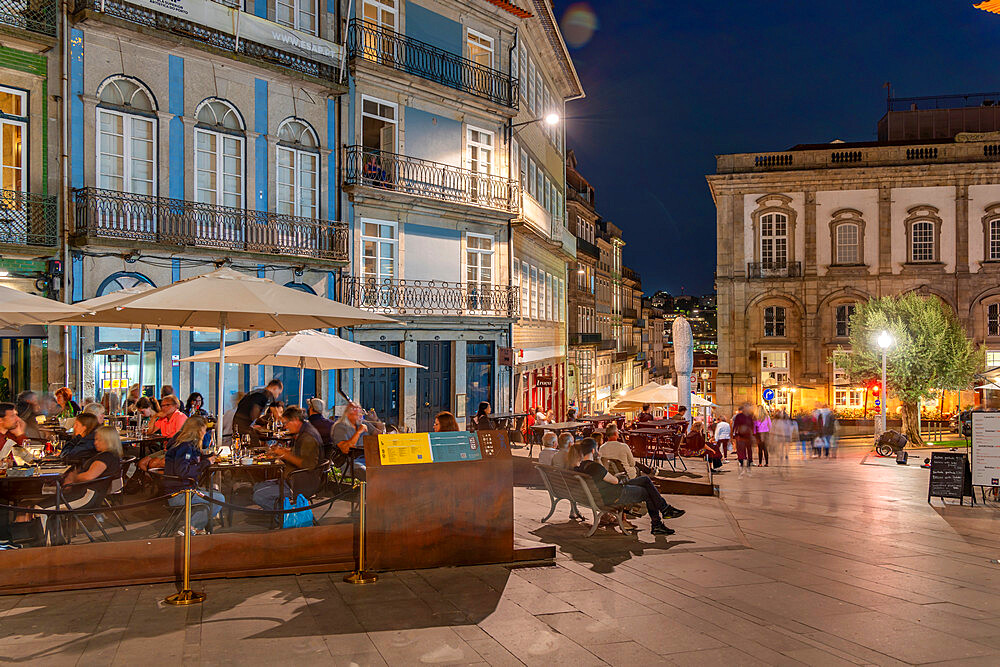 View of restaurant and buildings of the old town of Porto at dusk, Porto, Norte, Portugal, Europe