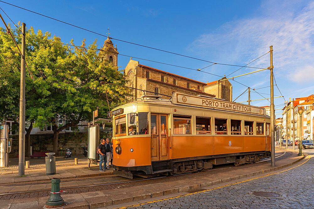 View of iconic city tram and Monument Church of St. Francis, Porto, Norte, Portugal, Europe