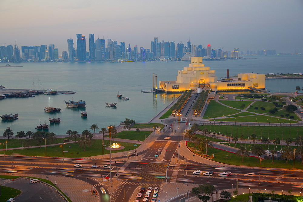 Museum of Islamic Art and West Bay Central Financial District from East Bay District at dusk, Doha, Qatar, Middle East