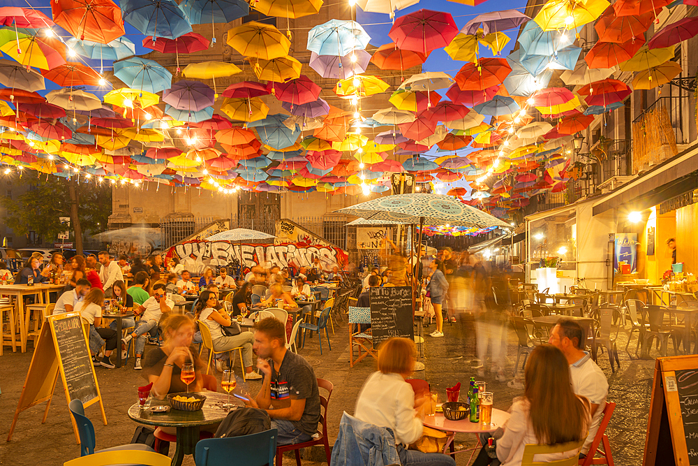 View of colourful umbrellas and restaurants on Via Gisira at night, Catania, Sicily, Italy, Mediterranean, Europe