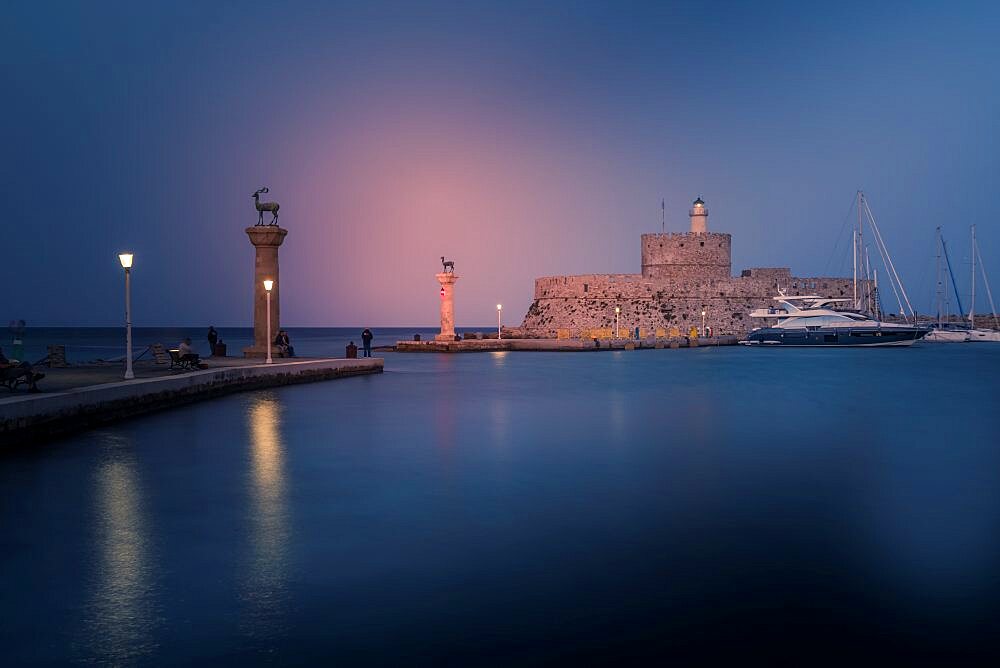 View of Saint Nicholas Fortress, Old Rhodes Town at dusk, UNESCO World Heritage Site, Rhodes, Dodecanese, Greek Islands, Greece, Europe