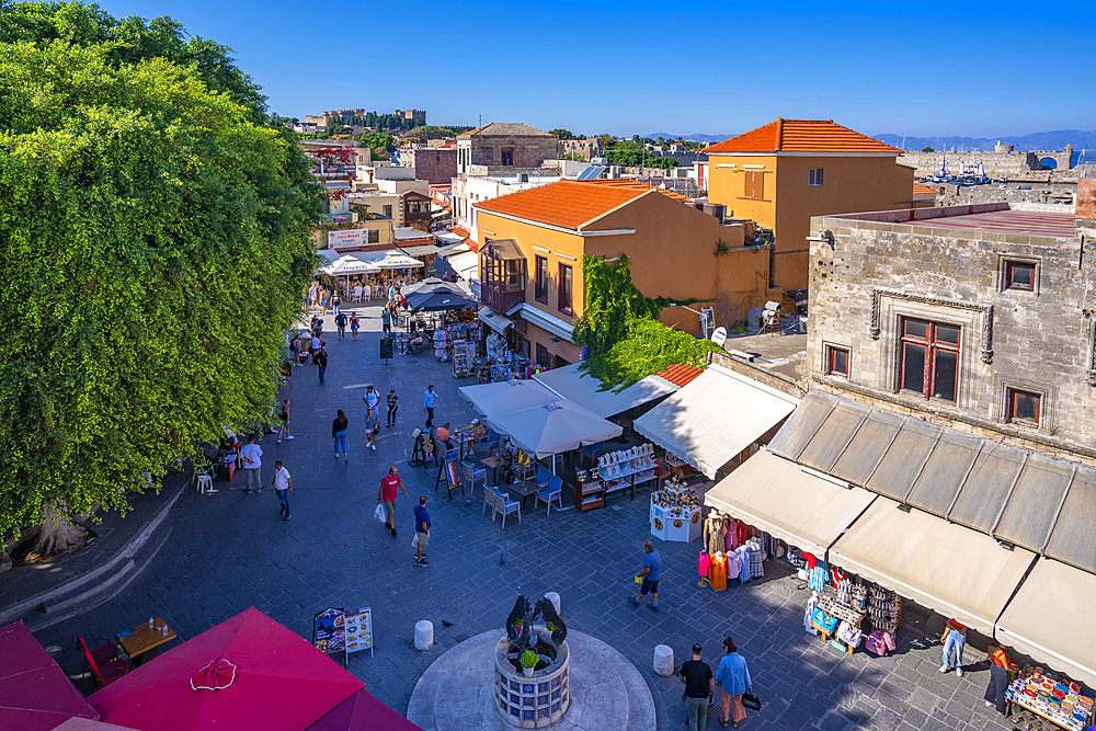 View of shops and cafes in Evreon Martyron (Jewish Martyrs Square), City of Rhodes, Rhodes, Dodecanese Islands, Greek Islands, Greece, Europe