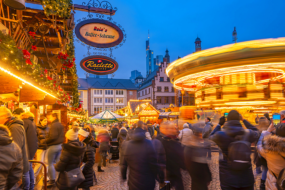 View of carousel and Christmas Market on Roemerberg Square at dusk, Frankfurt am Main, Hesse, Germany, Europe