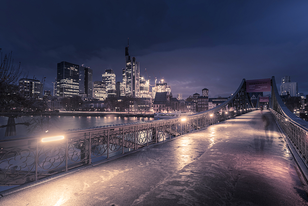 View of Eiserner Steg Bridge and Main River to the skyline at dawn, Frankfurt am Main, Hesse, Germany, Europe