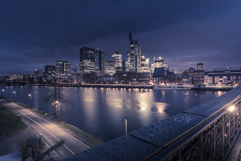 View from Eiserner Steg Bridge across Main River to the skyline of Frankfurt am Main at dawn, Frankfurt am Main, Hesse, Germany, Europe