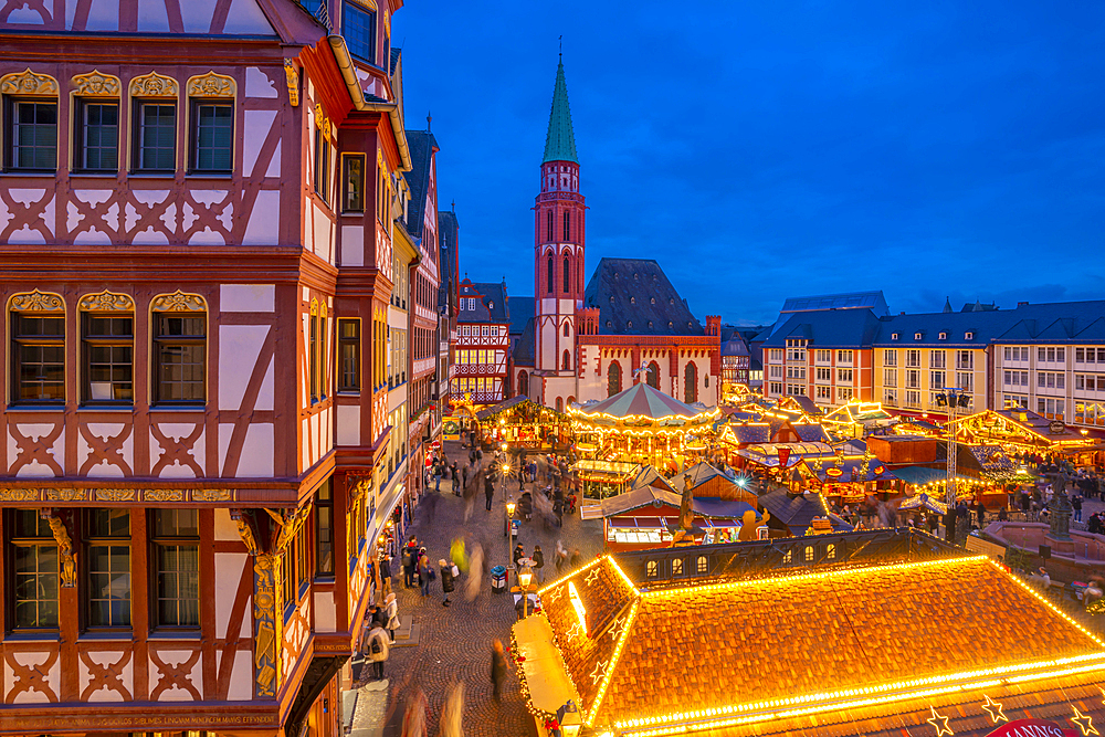 View of carousel and Christmas Market stalls at dusk, Roemerberg Square, Frankfurt am Main, Hesse, Germany, Europe