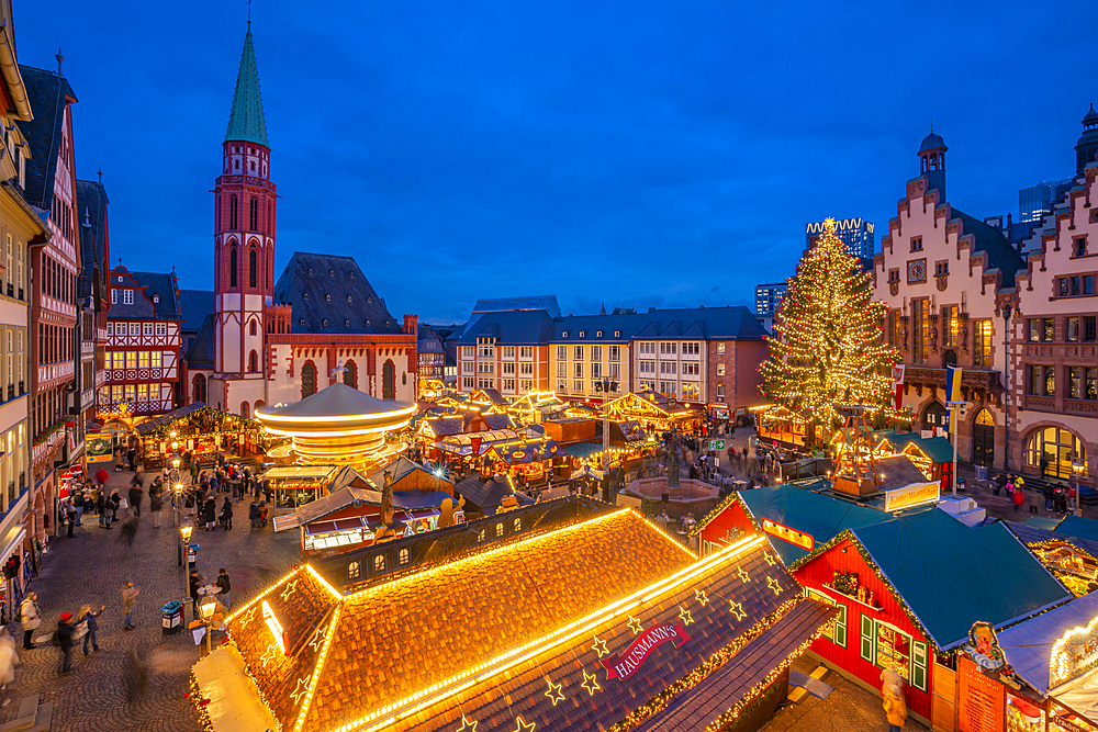 View of carousel and Christmas Market stalls at dusk, Roemerberg Square, Frankfurt am Main, Hesse, Germany, Europe