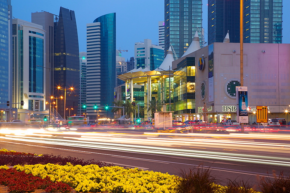 Contemporary architecture and traffic at dusk in the city centre, Doha, Qatar, Middle East