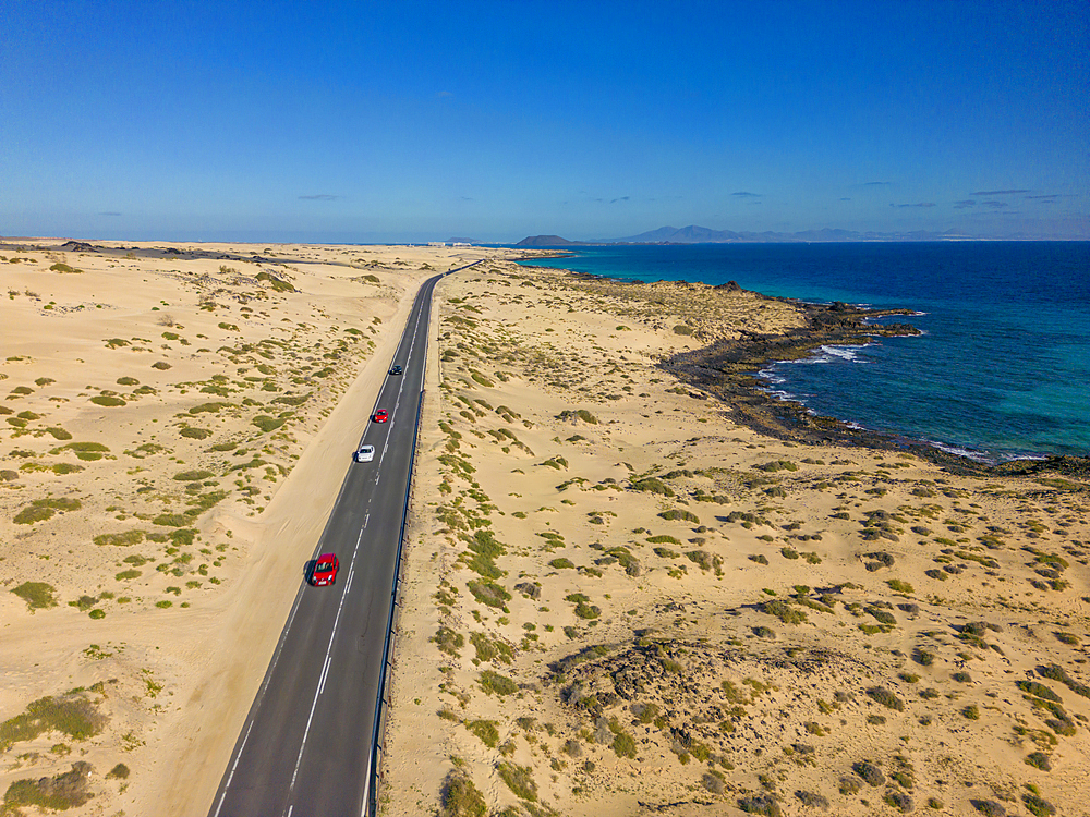 Aerial view of road through sand dunes overlooking the Atlantic Ocean, Corralejo Natural Park, Fuerteventura, Canary Islands, Spain, Atlantic, Europe