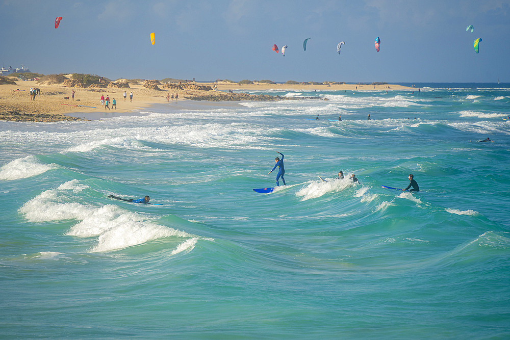 View of surfboarders and the Atlantic Ocean, Corralejo Natural Park, Fuerteventura, Canary Islands, Spain, Atlantic, Europe