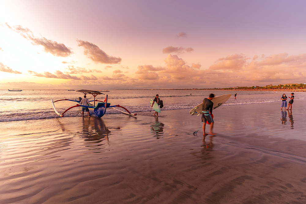 View of fishing outrigger on Kuta Beach at sunset, Kuta, Bali, Indonesia, South East Asia, Asia