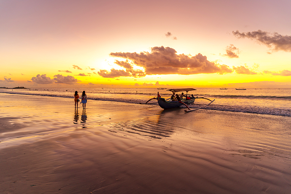 View of fishing outrigger on Kuta Beach at sunset, Kuta, Bali, Indonesia, South East Asia, Asia