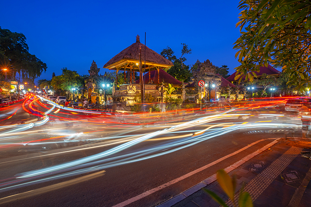 View of car trail lights and Ubud Palace at dusk, Ubud, Kabupaten Gianyar, Bali, Indonesia, South East Asia, Asia