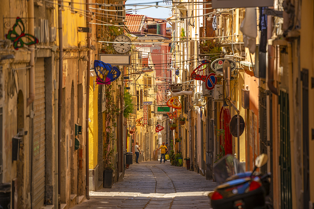 View of narrow street lined with rustic buildings in Sassari, Sassari, Sardinia, Italy, Mediterranean, Europe