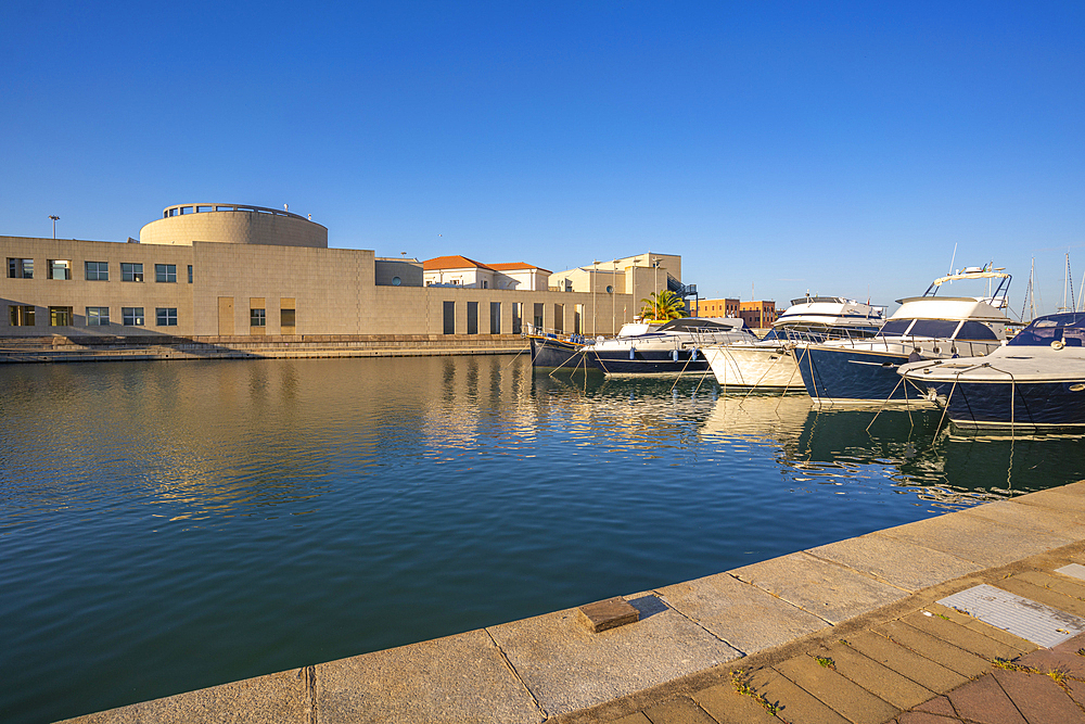 View of Archaeological Museum of Olbia and harbour boats on sunny day on Olbia, Olbia, Sardinia, Italy, Mediterranean, Europe