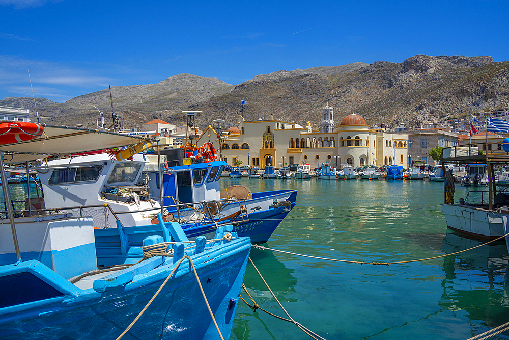 View of harbour boats in Kalimnos with hills in the background, Kalimnos, Dodecanese Islands, Greek Islands, Greece, Europe