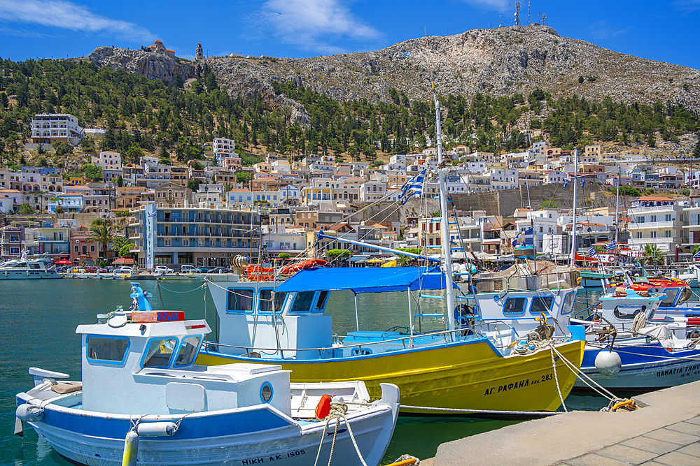 View of harbour boats in Kalimnos with hills in the background, Kalimnos, Dodecanese Islands, Greek Islands, Greece, Europe