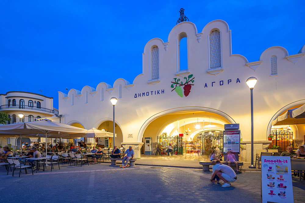 View of Kos Municipal Market in Eleftherias Central Square in Kos Town at dusk, Kos, Dodecanese, Greek Islands, Greece, Europe