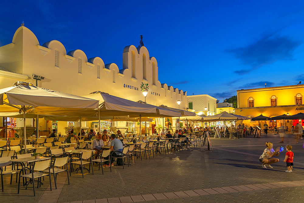 View of Kos Municipal Market in Eleftherias Central Square in Kos Town at dusk, Kos, Dodecanese, Greek Islands, Greece, Europe