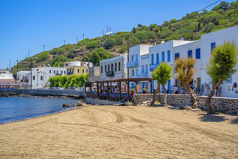 View of small beach and shops in the town of Mandraki, Mandraki, Nisyros, Dodecanese, Greek Islands, Greece, Europe